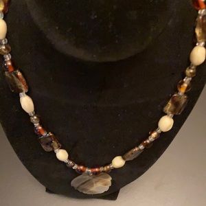 17 inch Necklace with Beads and Shell pendant.